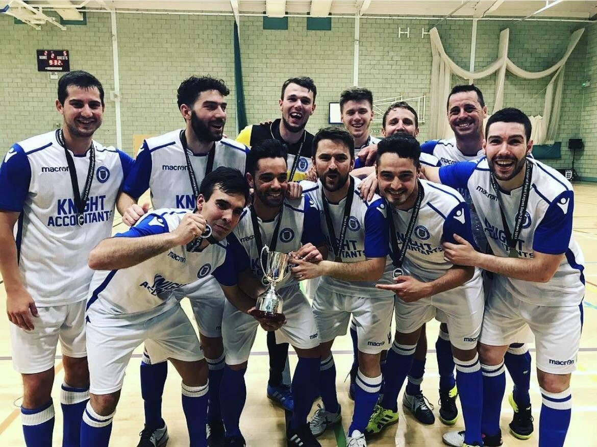 Sussex Futsal squad celebrating with a trophy